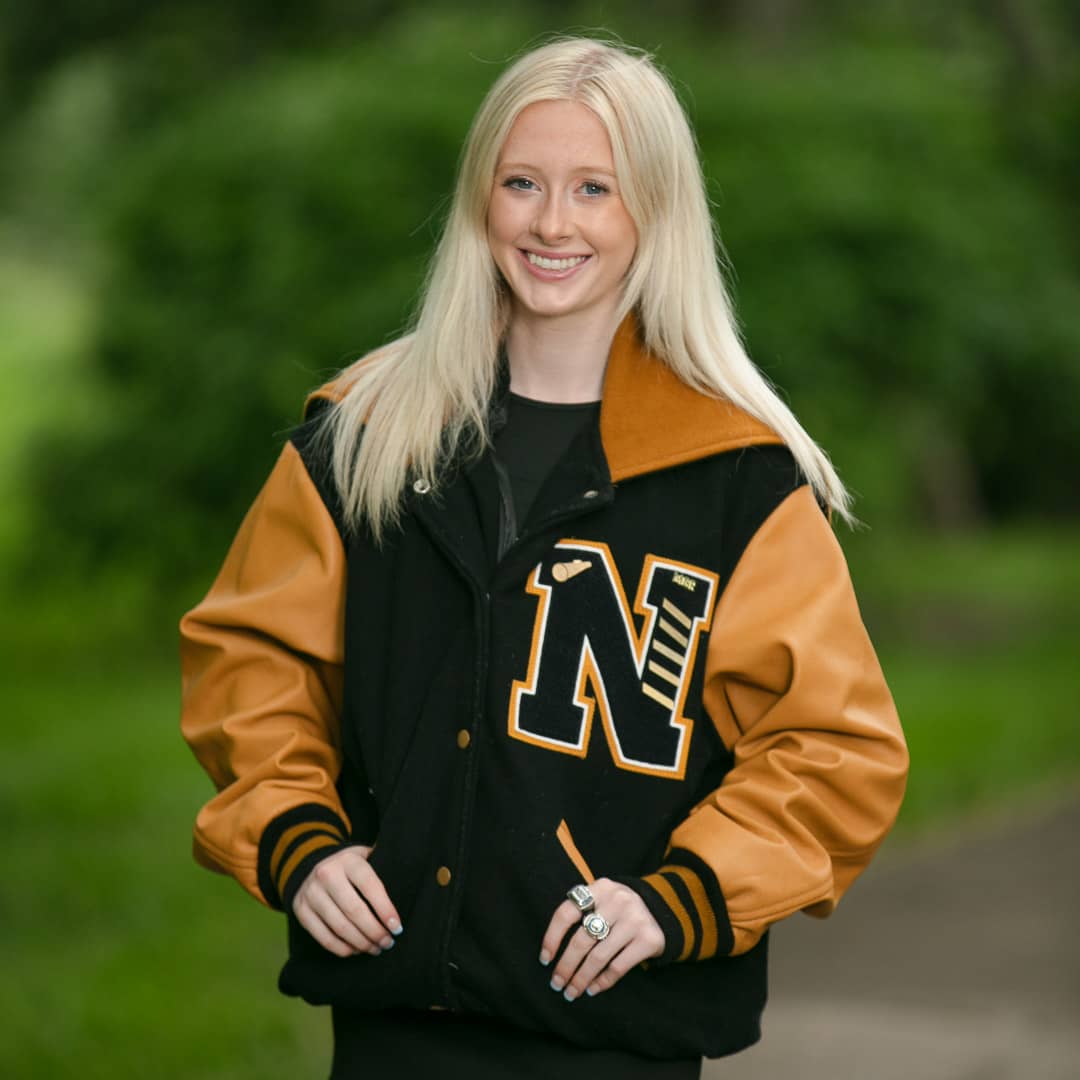 Senior portrait image of a Noblesville High School student posed along the edge of the water on the White River Greenway in Noblesville, Indiana.   Credit: Studio Kate Portrait Design - Noblesville Senior Pictures