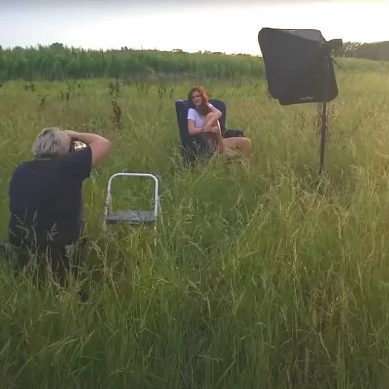 This is a screen capture from a behind the scenes video of our senior portrait session with Sarah in a wild flower field just south of Promise Road.